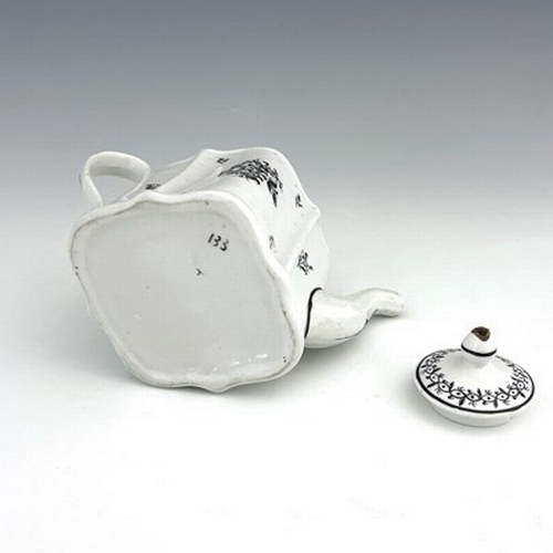 958 - A New Hall porcelain teapot, circa 1780, pattern 133, of small proportions, silver shape, 20cm long