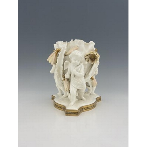 961 - Moore and Co., a blanc de Chine figural bowl, circa 1860, modelled as three winged putti supporting ... 