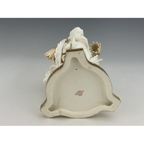 961 - Moore and Co., a blanc de Chine figural bowl, circa 1860, modelled as three winged putti supporting ... 