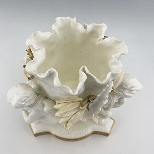 961 - Moore and Co., a blanc de Chine figural bowl, circa 1860, modelled as three winged putti supporting ... 