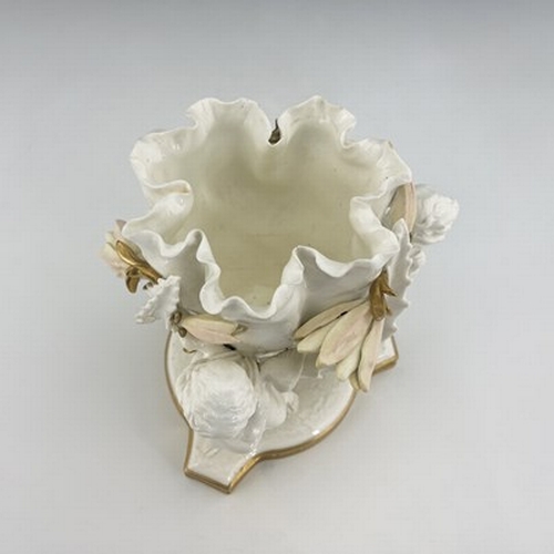 961 - Moore and Co., a blanc de Chine figural bowl, circa 1860, modelled as three winged putti supporting ... 