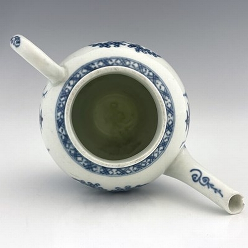 962 - A Worcester blue and white miniature teapot, crescent mark, circa 1760, painted in the Canonball pat... 