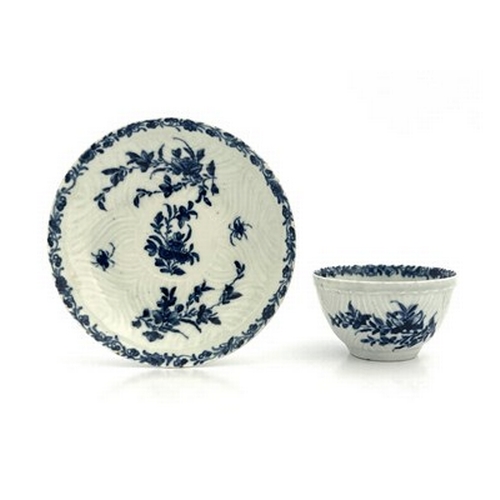 967 - A Worcester blue and white tea bowl and saucer, workman's marks, circa 1757, in the Feather Mould Fl... 