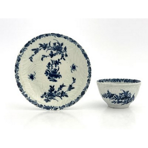 967 - A Worcester blue and white tea bowl and saucer, workman's marks, circa 1757, in the Feather Mould Fl... 