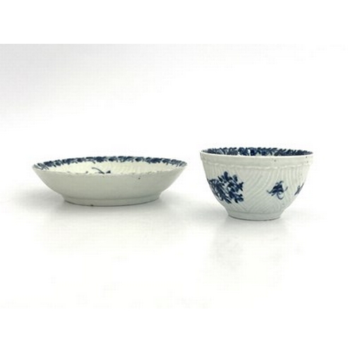 967 - A Worcester blue and white tea bowl and saucer, workman's marks, circa 1757, in the Feather Mould Fl... 