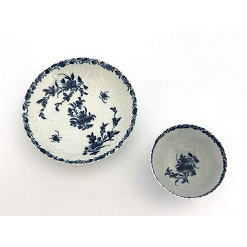 967 - A Worcester blue and white tea bowl and saucer, workman's marks, circa 1757, in the Feather Mould Fl... 