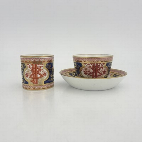 969 - A Spode trio, two cups and saucer, circa 1810, painted in Dollar pattern of iron red, blue and gilt,... 