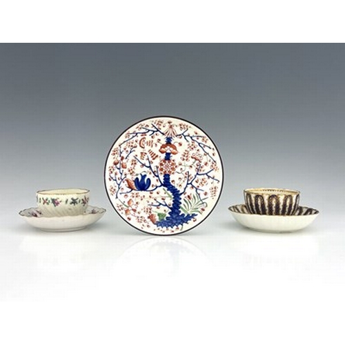 971 - A collection of Derby porcelain tea ware, including a Chelsea Derby wrythen moulded tea bowl and sau... 