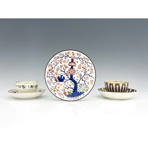 971 - A collection of Derby porcelain tea ware, including a Chelsea Derby wrythen moulded tea bowl and sau... 