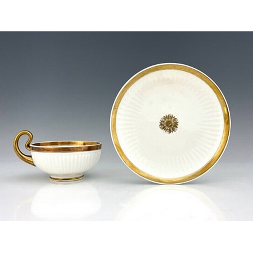 973 - A Swansea porcelain Paris shape breakfast cup and saucer, gilded motif and solid gilt bands, fluted ... 