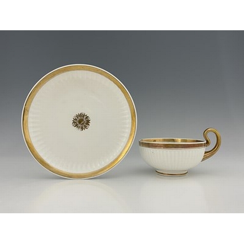 973 - A Swansea porcelain Paris shape breakfast cup and saucer, gilded motif and solid gilt bands, fluted ... 