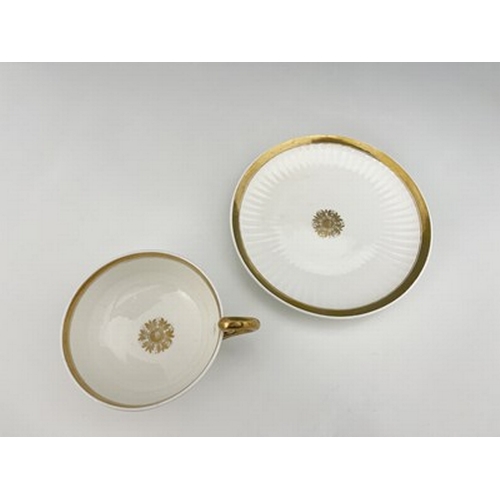 973 - A Swansea porcelain Paris shape breakfast cup and saucer, gilded motif and solid gilt bands, fluted ... 