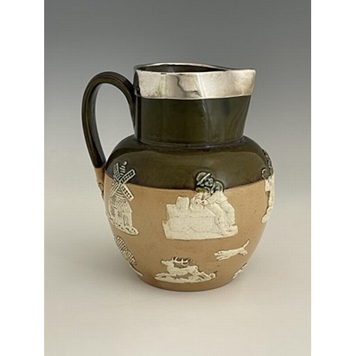 984 - A Doulton Lambeth sprigged stoneware jug, silver mounted, green and salt glazed with applied hunting... 