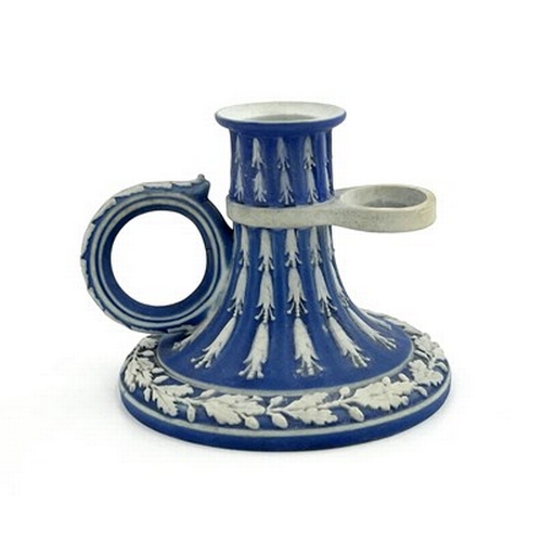 988 - A Wedgwood blue Jasperware chamber stick, circa 1790, fluted trumpet form, with husk garlands and oa... 