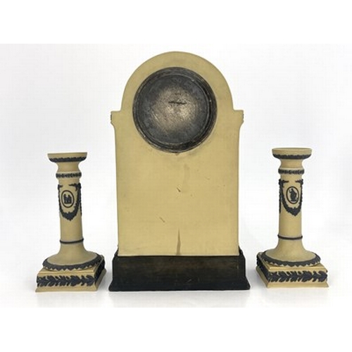 988A - A Wedgwood tri colour Jasperware clock garniture set, yellow ground, domed bracket form with black r... 