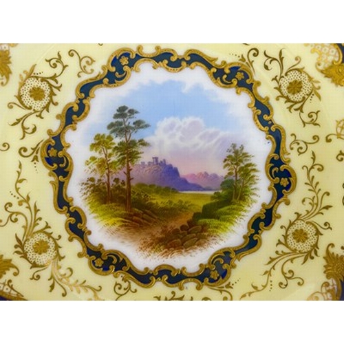 989 - A Coalport dessert dish, circular twin handled form, circa 1900, painted with a Scottish Loch scene ... 