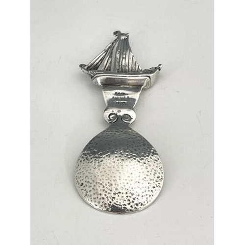 99 - Alexander Ritchie, an Arts and Crafts Iona silver caddy spoon, assay marks Shipton and Co., Chester ... 