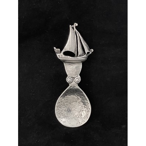 99 - Alexander Ritchie, an Arts and Crafts Iona silver caddy spoon, assay marks Shipton and Co., Chester ... 