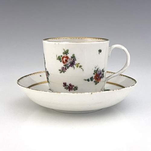 993 - A Richard Champion Bristol porcelain cup and saucer, circa 1770, painted with central floral bouquet... 