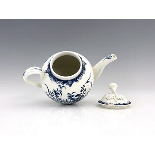 999 - A Lowestoft blue and white porcelain teapot and cover, crescent mark, circa 1770, decorated in the M... 