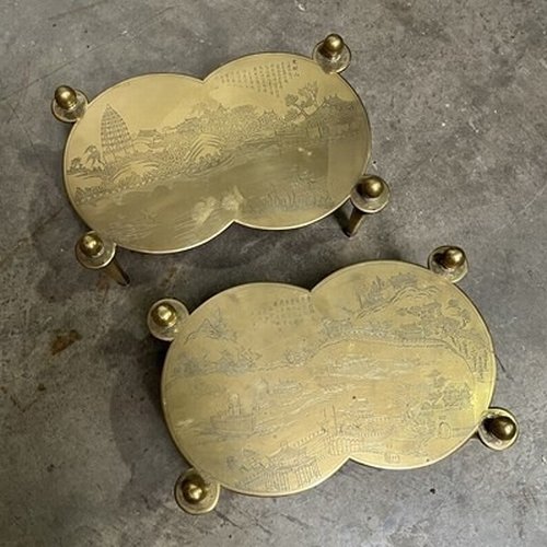 1027 - A pair of brass footmen, engraved pagoda landscapes (2)