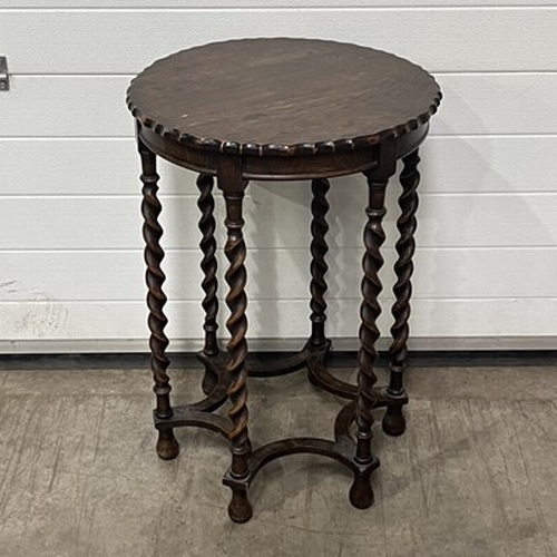 1030 - An occasional table, scalloped edge, with barley twist supports, united by a star shaped stretcher D... 