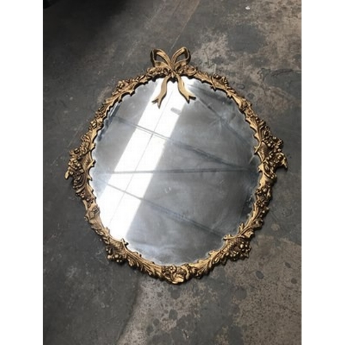 1035 - Oval metal framed gold mirror