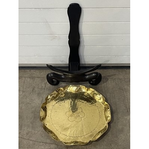 1037 - An brass plate on stand, scalloped edge with a central leaf engraving, together with a similar small... 