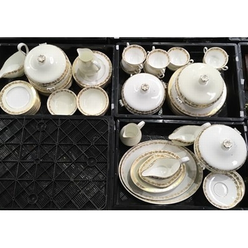 14 - A Wedgwood part dinner service with gilded ivy border on ivory ground ( 3 trays )