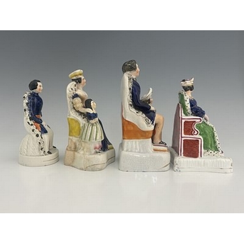 146 - Four Staffordshire royal figure groups, circa 1840, including Queen Victoria, possibly at her corona... 