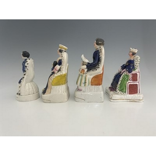 146 - Four Staffordshire royal figure groups, circa 1840, including Queen Victoria, possibly at her corona... 