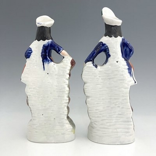 148 - A pair of Staffordshire shepherd and shepherdess figures in Scottish Highland dress, circa 1850, Sco... 