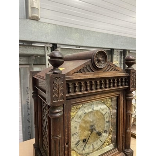 180 - A German carved oak Aesthetic Movement mantel clock, architectural case, with silvered chapter ring ... 