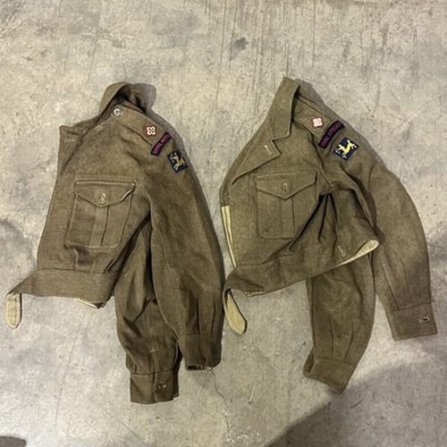 1A - A collection of Military apparel, to include two Royal Artillery battle dress jackets, two Royal Art... 