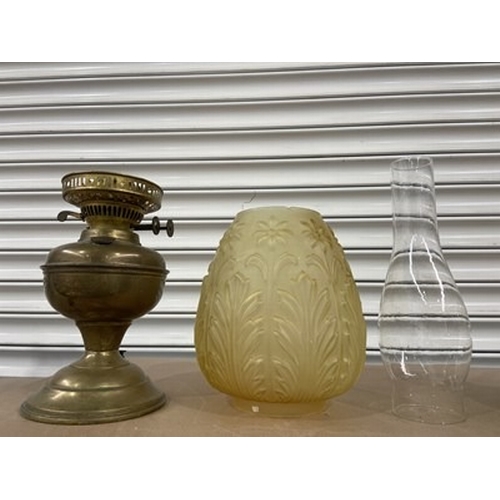 231 - A Victorian brass and amber moulded glass shade oil lamp, Aesthetic Movement style, 43cm high