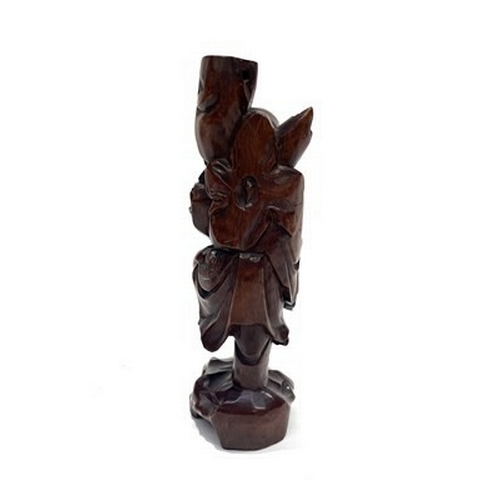 237 - A Chinese root carving of an elder, standing holding a knurled staff, 31cm high