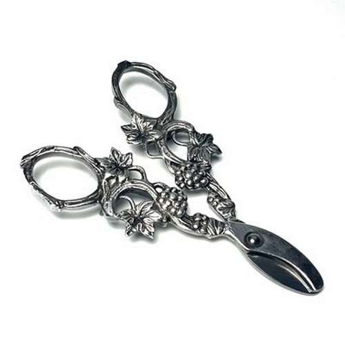 296 - A pair of white metal Grape scissors, with cast fruiting vine decoration together with a gold plated... 