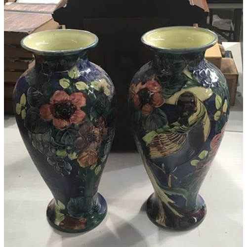 3 - A pair of Thomas Forester & Sons Trogon ware vases, baluster form, circa 1900, relief decorated with... 