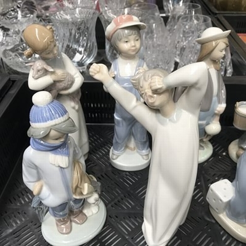 36 - A collection of ten Lladro figures, including A Lesson Shared, Caribbean Kiss, Dutch Boy with Milk P... 