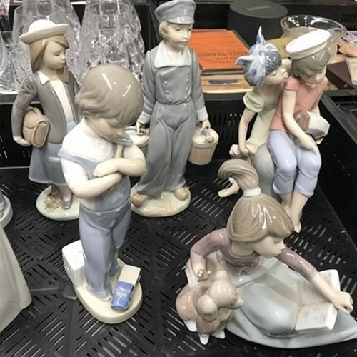 36 - A collection of ten Lladro figures, including A Lesson Shared, Caribbean Kiss, Dutch Boy with Milk P... 