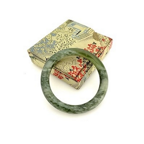 362 - A green hardstone bangle bracelet, boxed