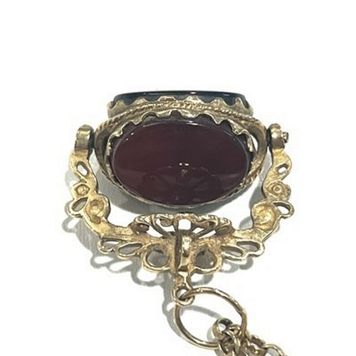 400 - A 9ct gold hardstone swivel fob, suspended from a 9ct gold belcher-link chain, total weight 11.5g