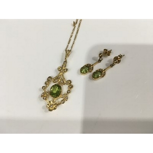 420 - A 9ct peridot and seed pearl pendant suspended on an 18k figaro fine link chain, together with a pai... 