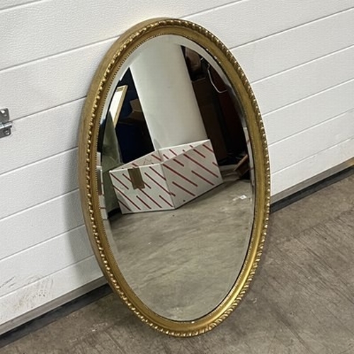 769 - Two converted cheval mirrors 33 x 128 cm, and 36 x 130 cm, together with a oval, gilt, bevelled edge... 