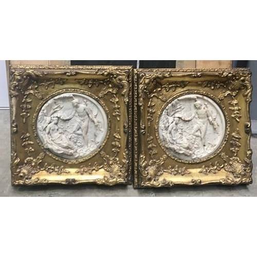 799 - A pair of cast composite roundel wall plaques with classical figure scenes, 17cm diameter, gilt fram... 