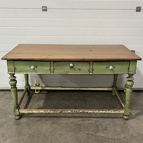 936 - A rustic kitchen table, fitted with three frieze drawers, on turned and block supports, distressed g... 