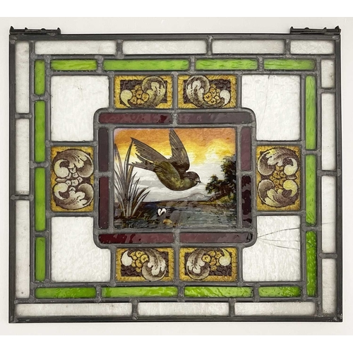 246 - Two Aesthetic Movement leaded glass panels, painted with birds in flight over wetlands, within conce... 