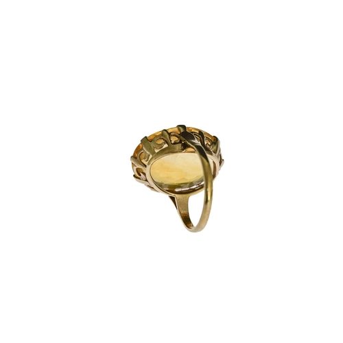 25 - A 9 carat gold citrine single stone ring, approx 2.1cm long, size M, 6.1g