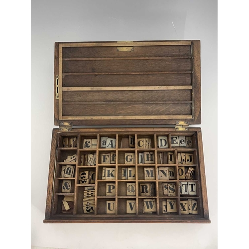 268 - A Victorian learning or teaching aid, the hinged wooden box containing alphabetical, numerical, and ... 