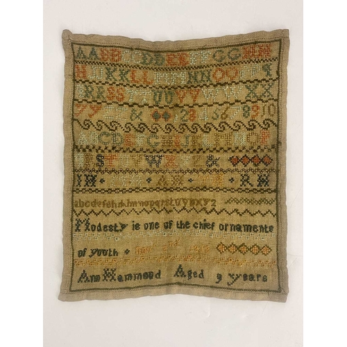 276 - A George III sampler, by Ann Hammond, aged 9, dated 1812, embroidered with the alphabet, numbers and... 